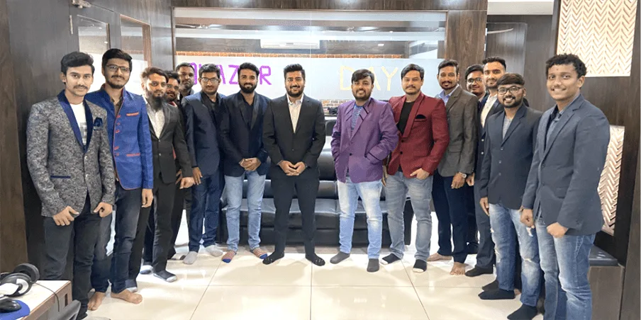 Team in blazers on Blazer Day at the Groovy Web office