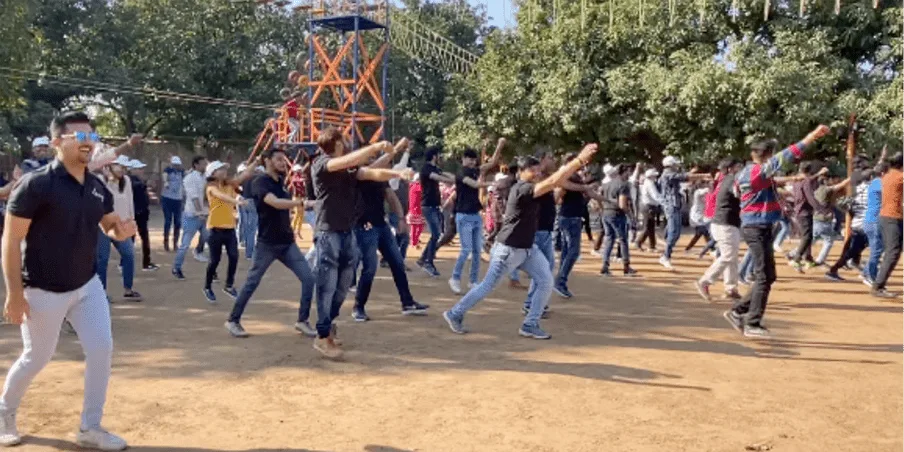 Team dancing together outdoors during a team outing